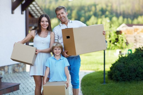 Local removals team handling furniture in Goodmayes
