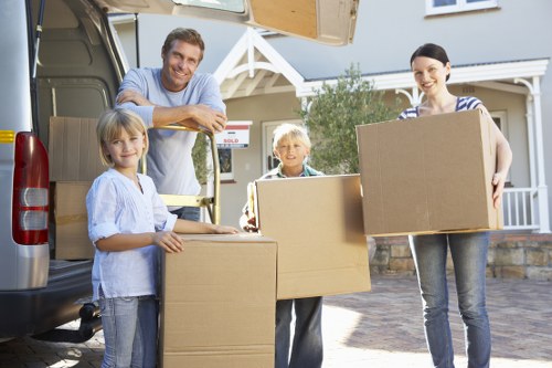 Loading household furniture into a van for transport
