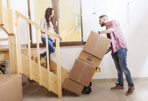 Professional movers handling household items during a Goodmayes relocation