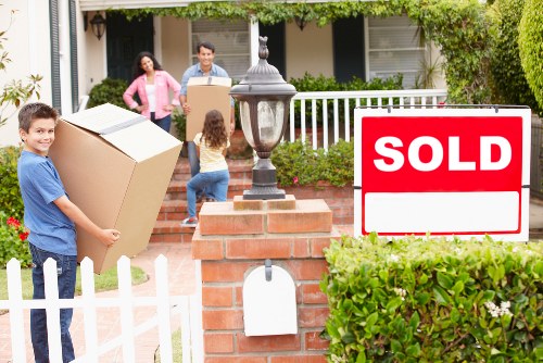 Packed boxes and furniture prepared for storage in Goodmayes