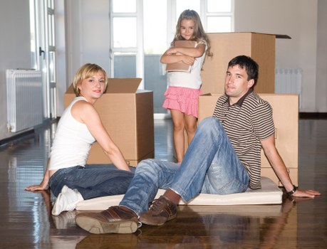 Local removal team handling furniture during house removals in Goodmayes